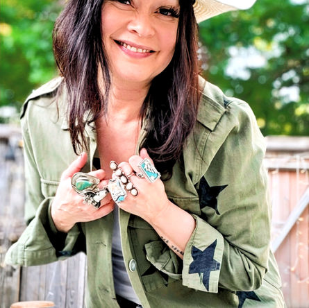 Ali wearing a Gigi Pip hat and her statement rings available on her online shop