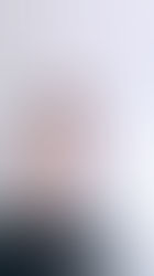 A Boho-Western look featuring a floral print jumpsuit and a long, flowing lace duster coat, styled with a wide-brim white hat and lavender boots.