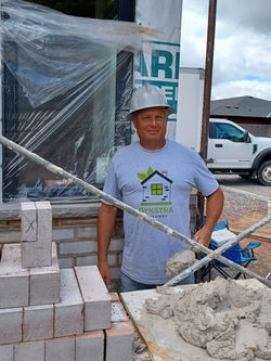 Rob Dykstra working on masonry