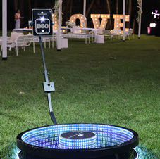 Photo booth with camera mounted on spinning arm