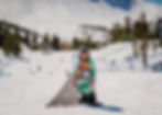 Young kid trying to snowboard for the first time at Mammoth Mountain