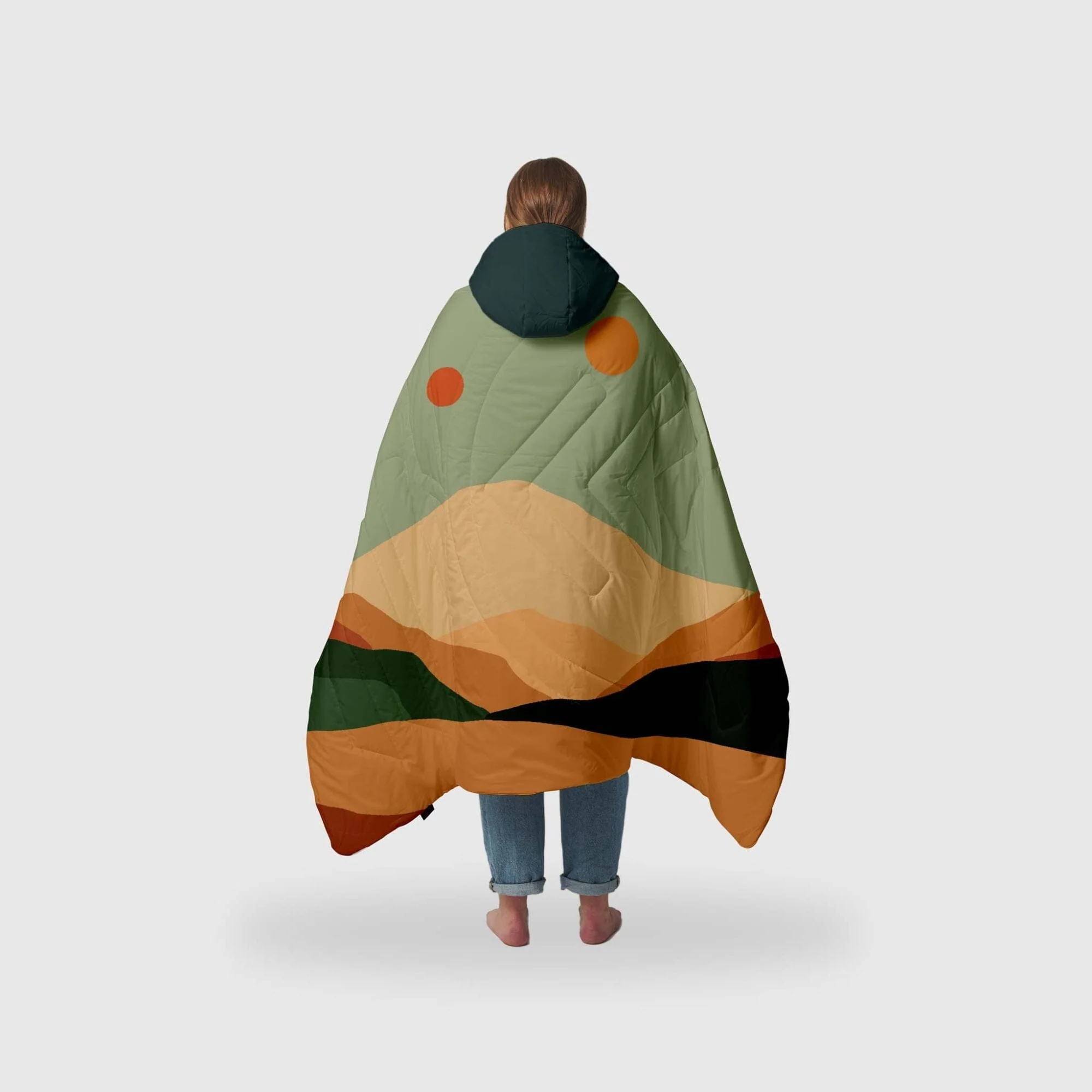 This blanket has a mountain scene at sunrise on it. It keeps you warm on camping trips or anytime your outside.