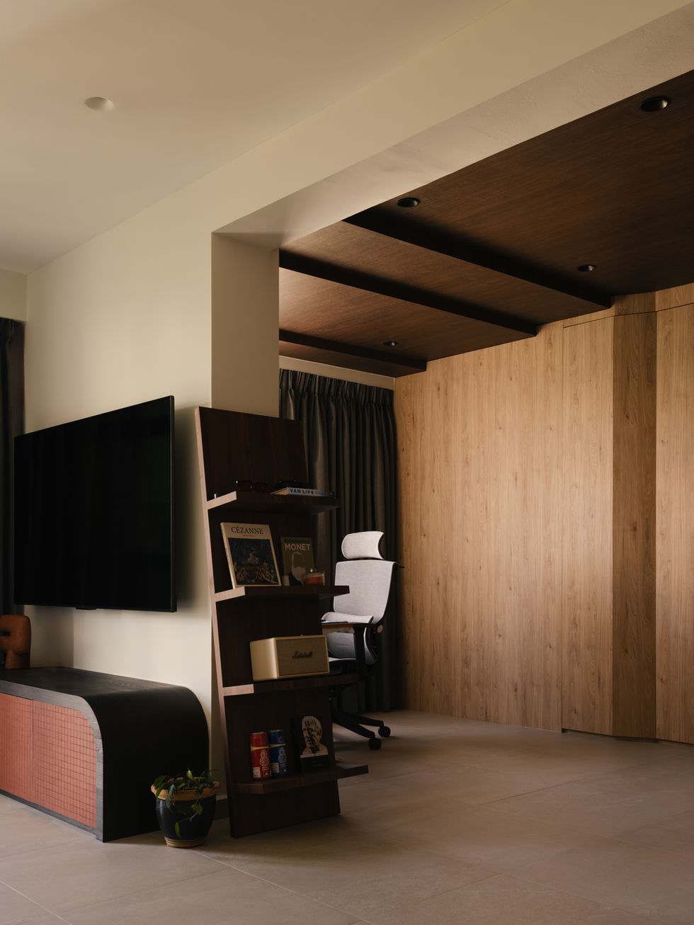 Open-concept study area that mimics a cave provides a conducive atmosphere for work; cascading dark wood planks give a sense of warmth and protection