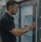 Man opening a commercial fridge