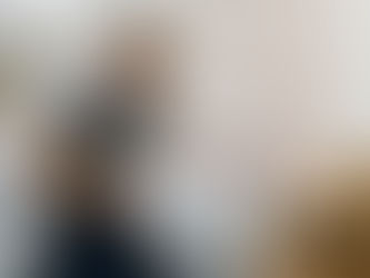 Installer measuring hygienic wall panel in hospital room