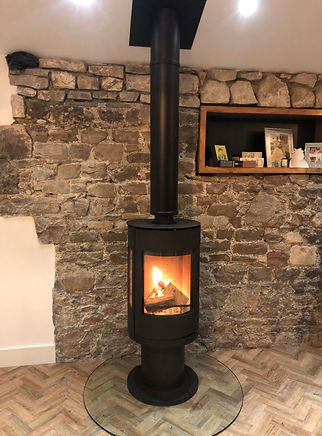 freestanding through ceiling glass hearth.JPEG