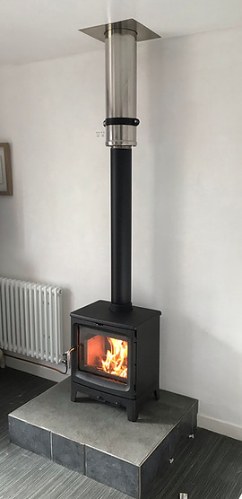 saltfire bugnut on plinth through ceiling silver flue.JPEG