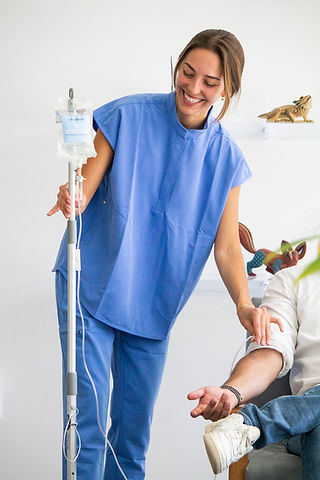 Key Basis IV nurse starting an IV for a client at home
