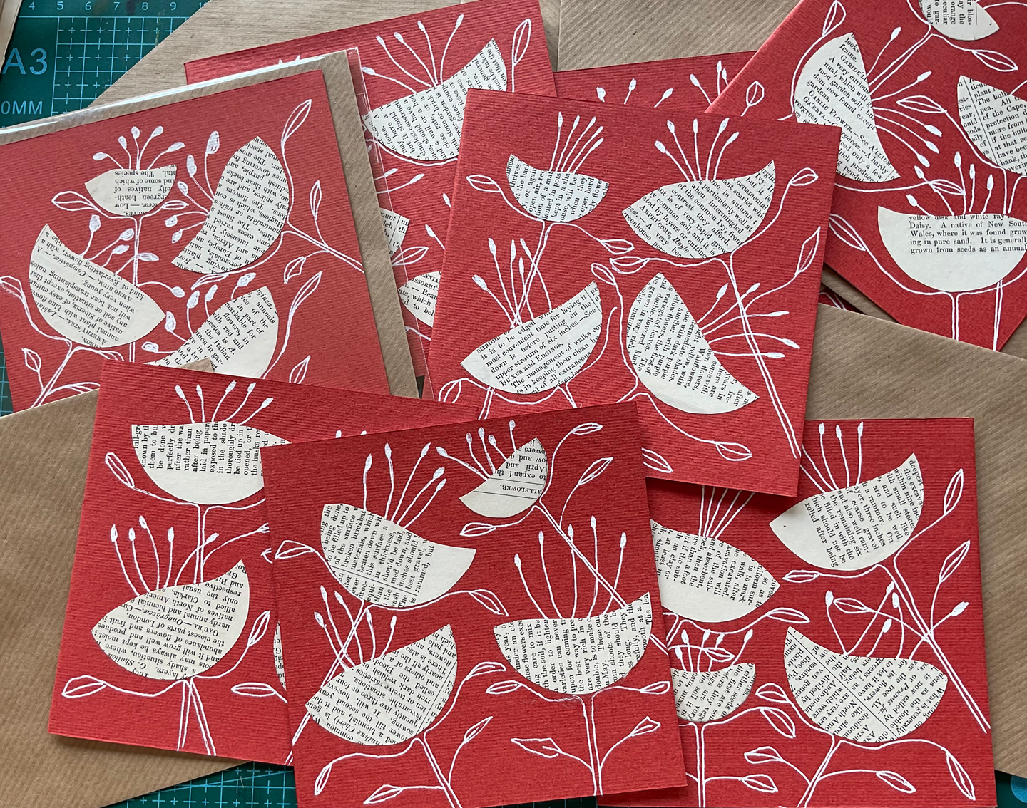 Red cards with vintage text collage flowers and ink