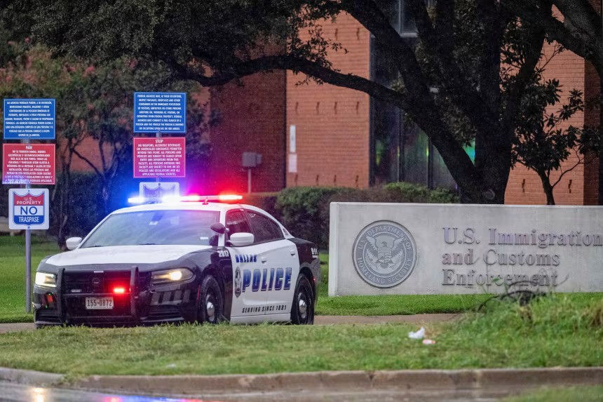 Law enforcement responds to a shooting at an ICE field office in Dallas on Wednesday.Jeffrey McWhorter/Reuters