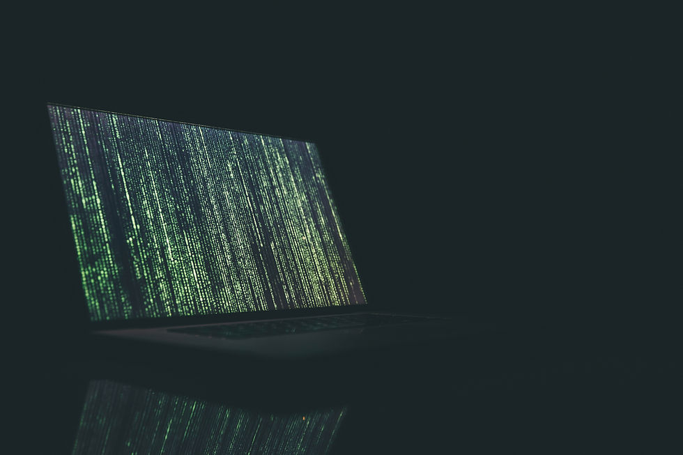 A laptop screen displaying green matrix-like code in a dark environment, symbolizing data streams, cybersecurity, or coding.