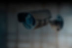 Modern security camera installed in an office environment for surveillance.