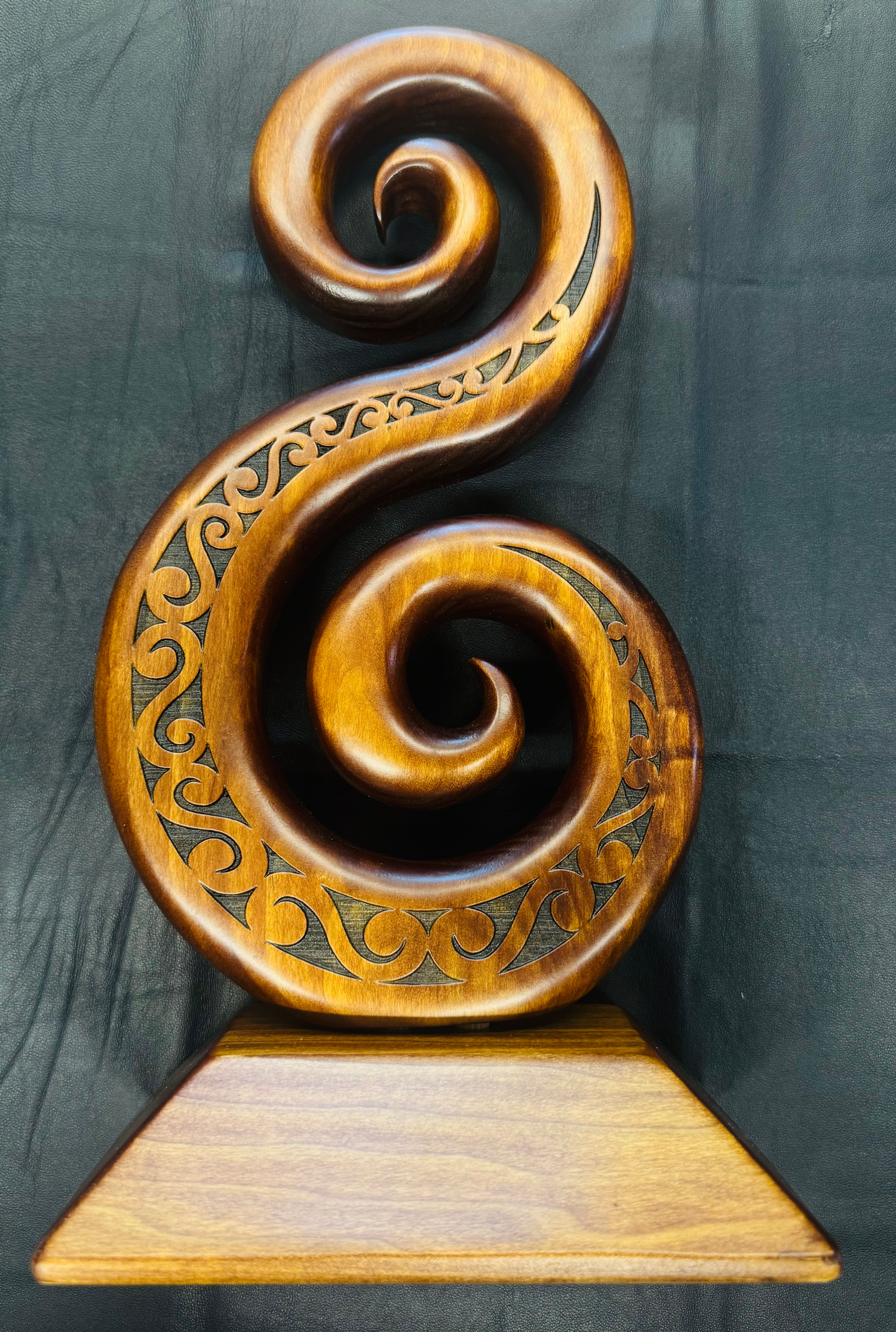 Wooden double koru