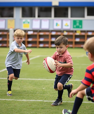 children playing with rugby ball in elementary school.jpg