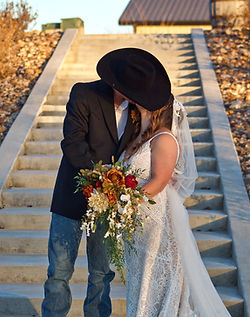 Couple kissing at their wedding by Brooklyn Elise Photography Kansas Photographer