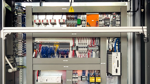 Detailed view of terminal wiring inside a substation automation control panel, highlighting device connectivity and organized cabling