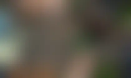 Directly above shot of a woman putting something on a table