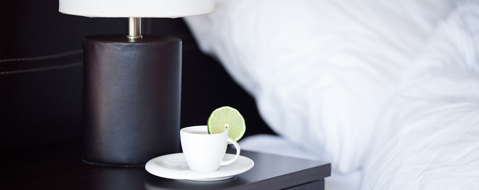 Hotel bedside table with tea