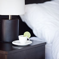 Hotel bedside table with tea