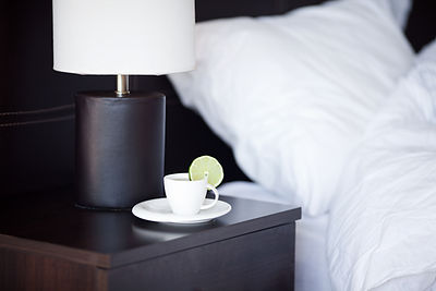 Hotel bedside table with tea