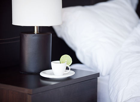 Hotel bedside table with tea