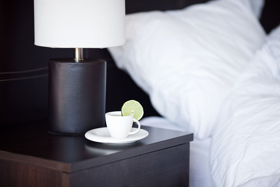 Hotel bedside table with tea