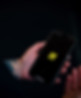 hand holding a phone with a training app on screen