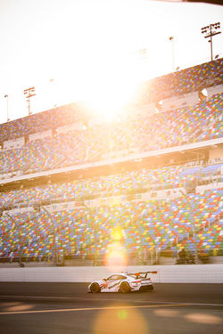 Car on track in front of stands_
