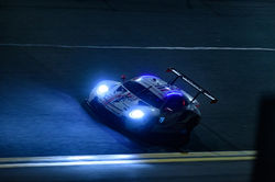 Porsche on track at night_