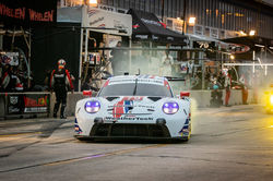Porsche pulling out of pit road.