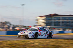 Porsche taking off on a turn.