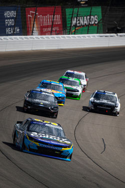 Camaro in the middle of traffic.