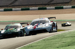 Porsche pulling up over a turn.