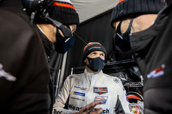 Pit crew member huddle.