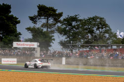 Porsche taking off on the track.
