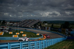 Mercedes under a rainy sky.