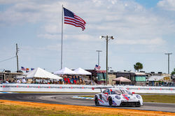 Porsche racing on the track.
