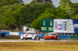 Porsche racing on track.