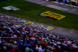 Camaro coming across the starting line in traffic.