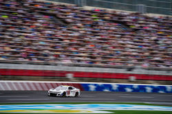 Camaro racing past the crowd.