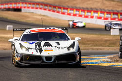 Ferrari hugging a turn.