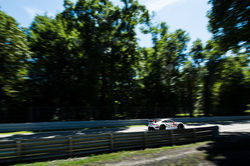 Porsche driving on a straight away_