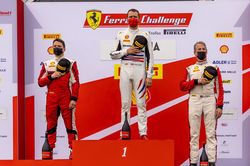 Drivers standing on the podium.