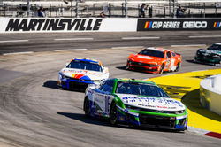 Camaro leading traffic rounding a turn.