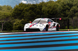 Porsche racing around a turn.