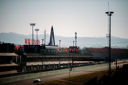 Ferrari driving past the grand stand during practice.