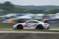Porsche taking off on a straight away.