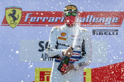 Cooper spraying champagne.