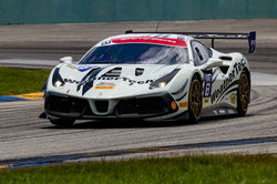 Ferrari racing during the day.