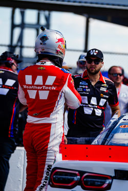 SVG on the track with crew members.